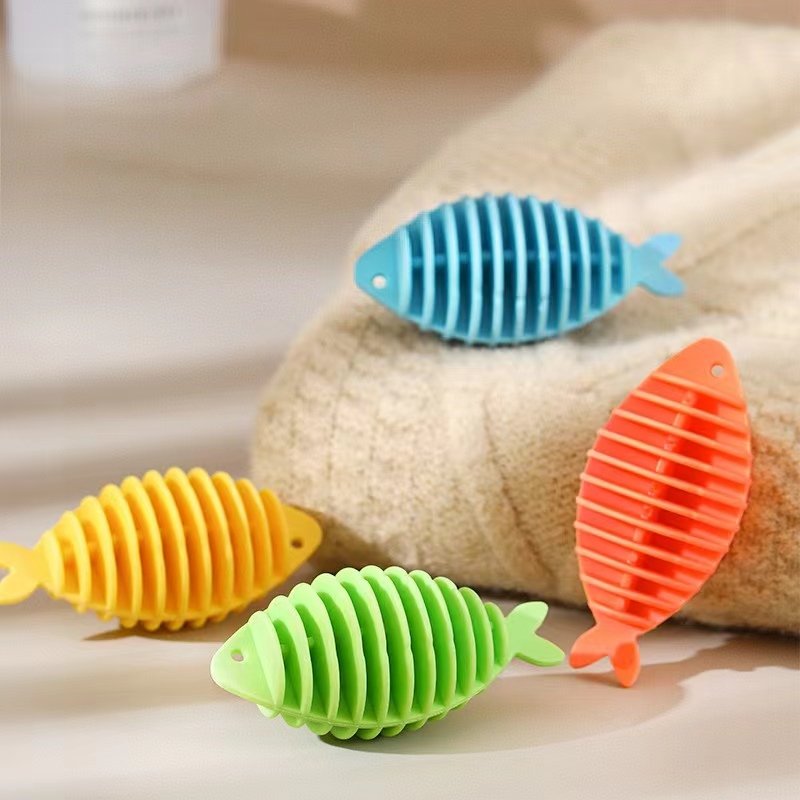 كرات السمك المطاطية لمنع تشابك الملابس أثناء الغسيل كرات السمك المطاطية لمنع تشابك الملابس أثناء الغسيل